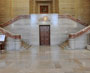 View enlarged image of the Grand Entrance Hall of the Supreme Court of Canada Building with 2 staircases leading up from the entrance hall to the Main Courtroom